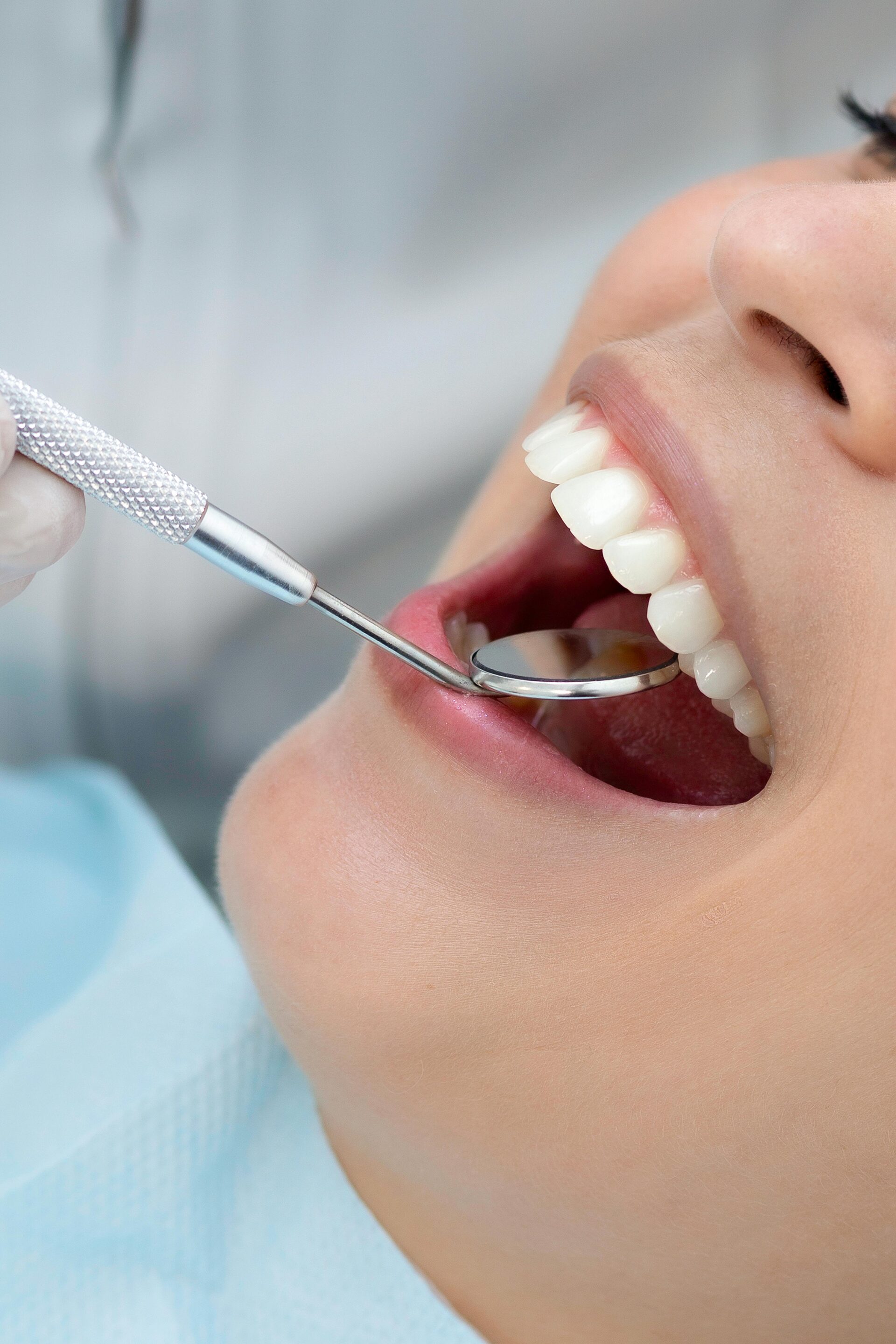 Dental mirror exam close-up