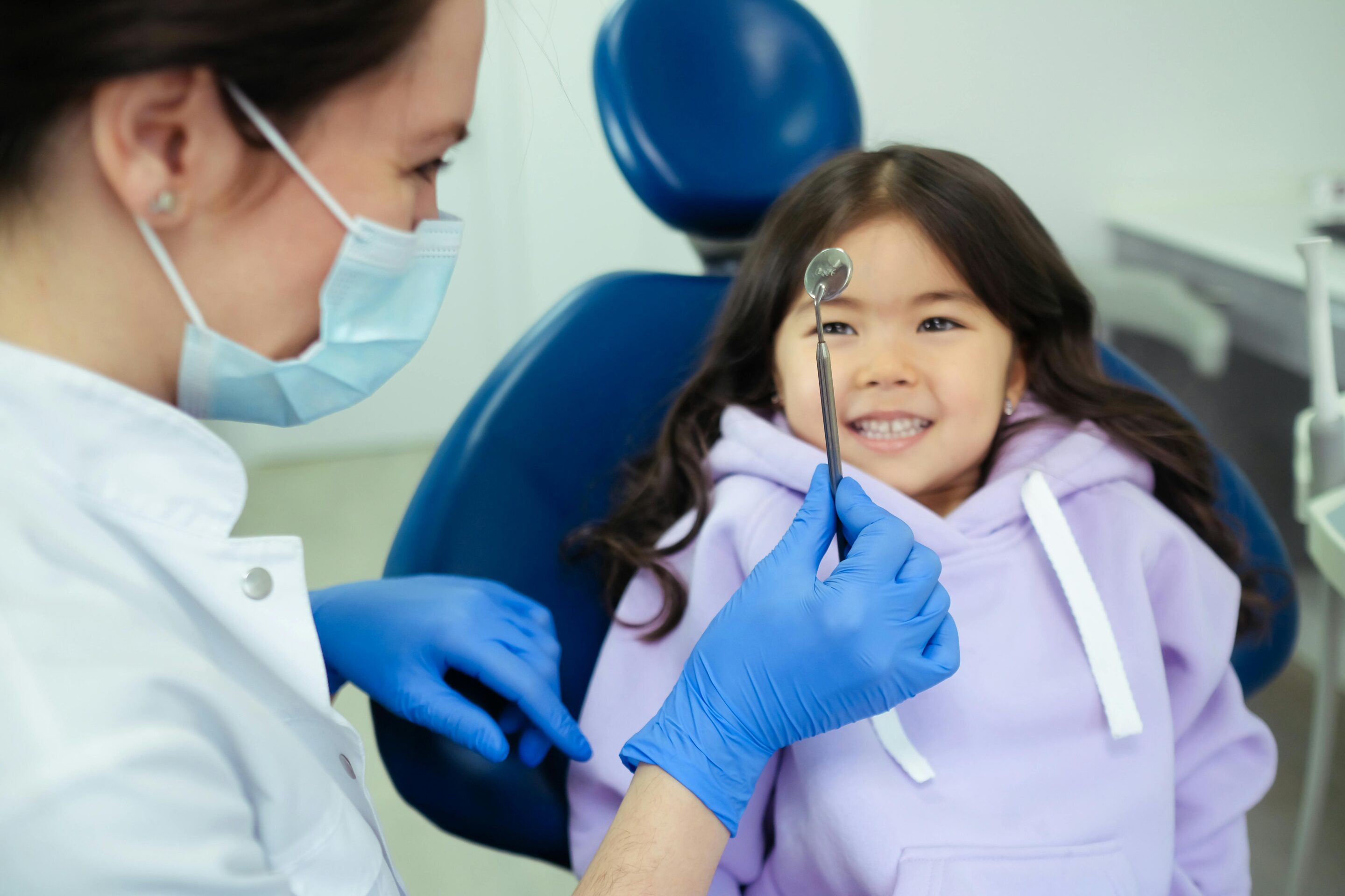 Child smiling at the dentist before treatment